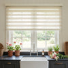 Linen-blend zebra shade with alternating sheer bands in a bright kitchen window