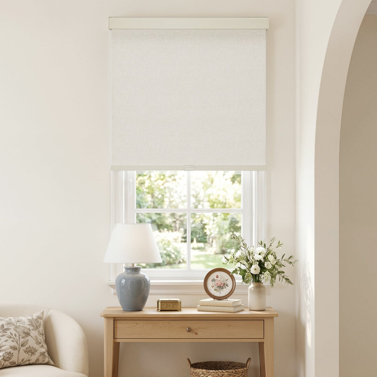 Custom Harlan jacquard blackout roller shade in white on a window