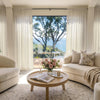 Feather custom lightweight off-white sheer curtains in airy, light-filled room.