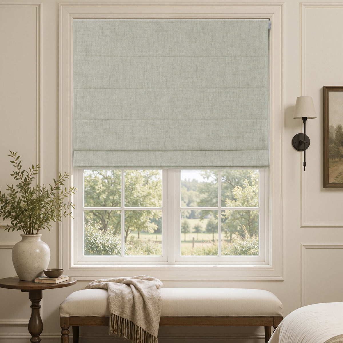Alder linen look blackout Roman shade in light gray on a white window frame