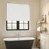 White Ashby blackout roller shade, minimalist matte plain weave fabric.